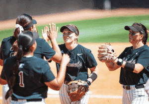 softball players wearing gorout diamond devices high fiving