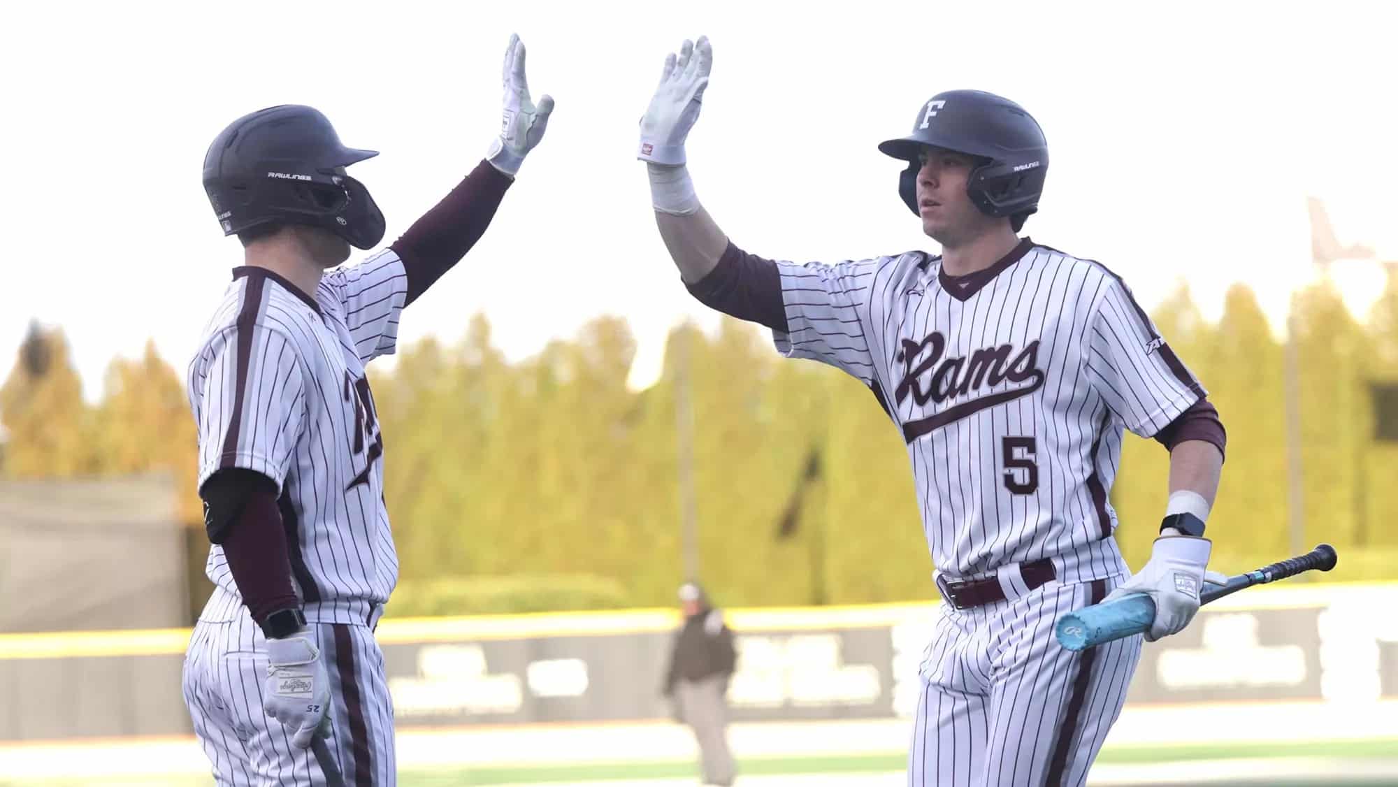 fordham university baseball players high five
