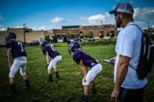 youth football linebackers in athletic position