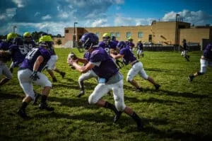 youth football quarterback scrambling