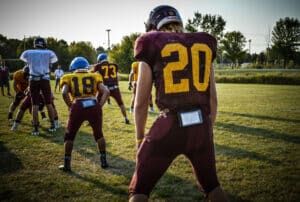 football running back lining up behind offensive line