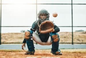baseball catcher receiving pitch
