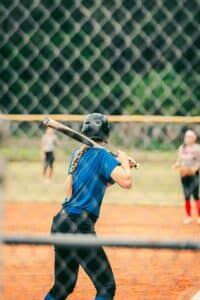 youth softball batter hitting