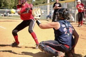 softball catcher in game action