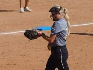 youth travel softball pitcher looking at gorout diamond pitch calling wristband