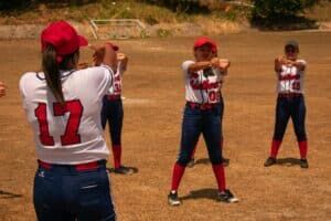 softball players warming up before game