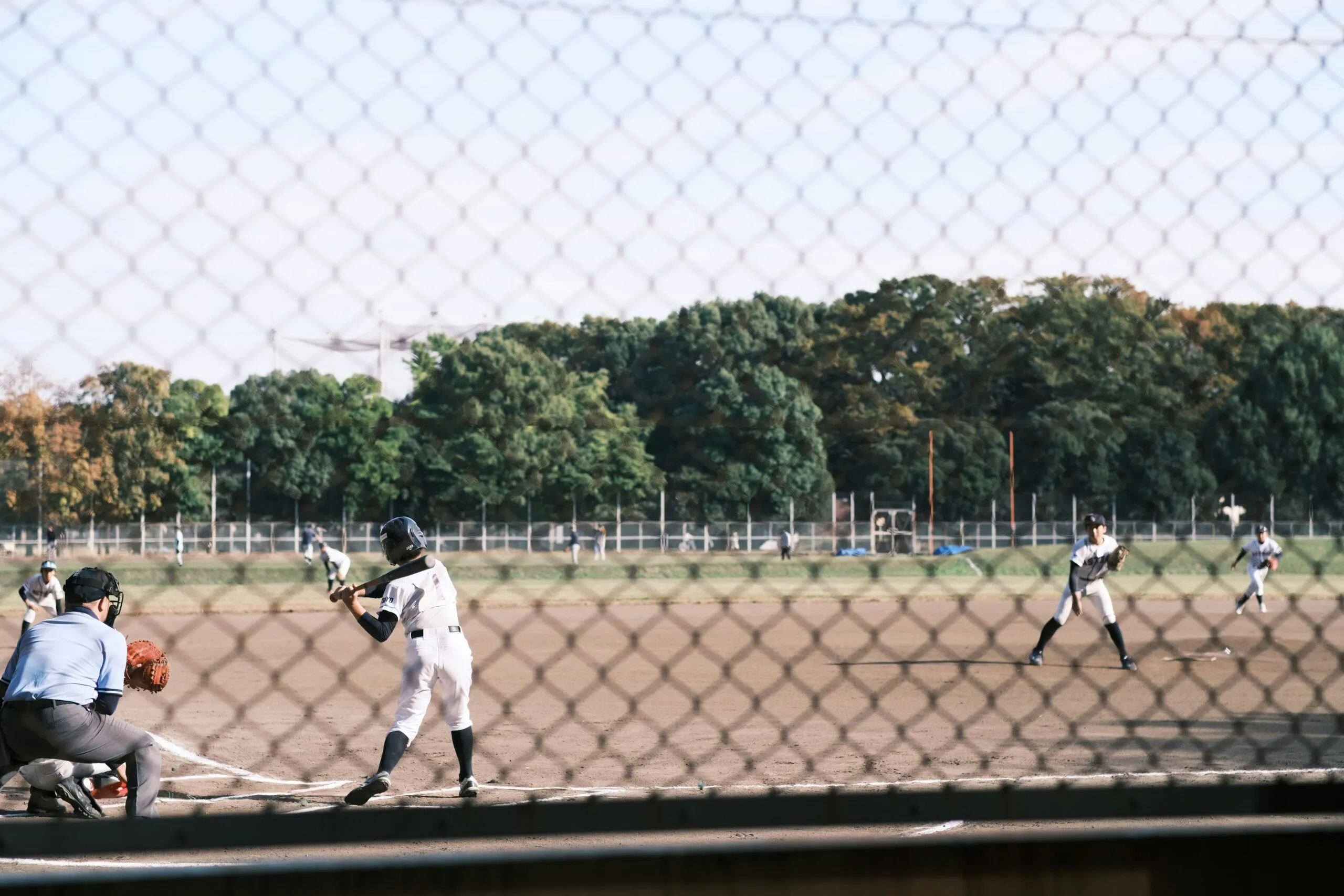 umpire calling pitch in youth baseball game