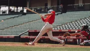 baseball player hitting ball