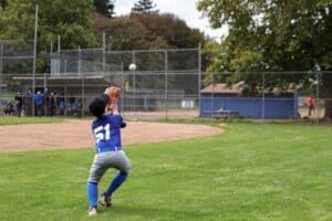 baseball player catching pop up in drill