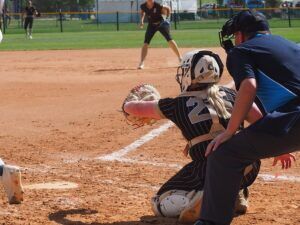 softball catcher receiving pitch
