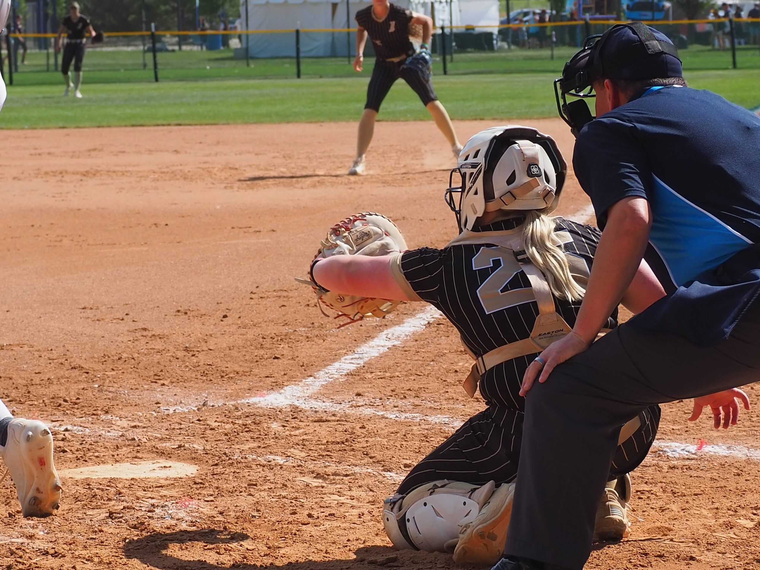 softball catcher receiving pitch