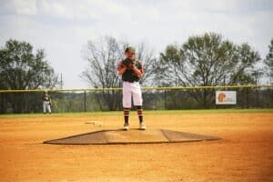 youth baseball pitcher in windup