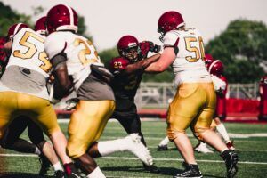 football defensive lineman challenging offensive line