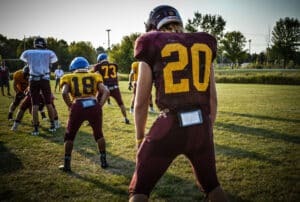 football running back lining up behind offensive line