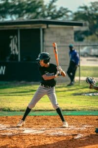 youth baseball batter at home plate in game