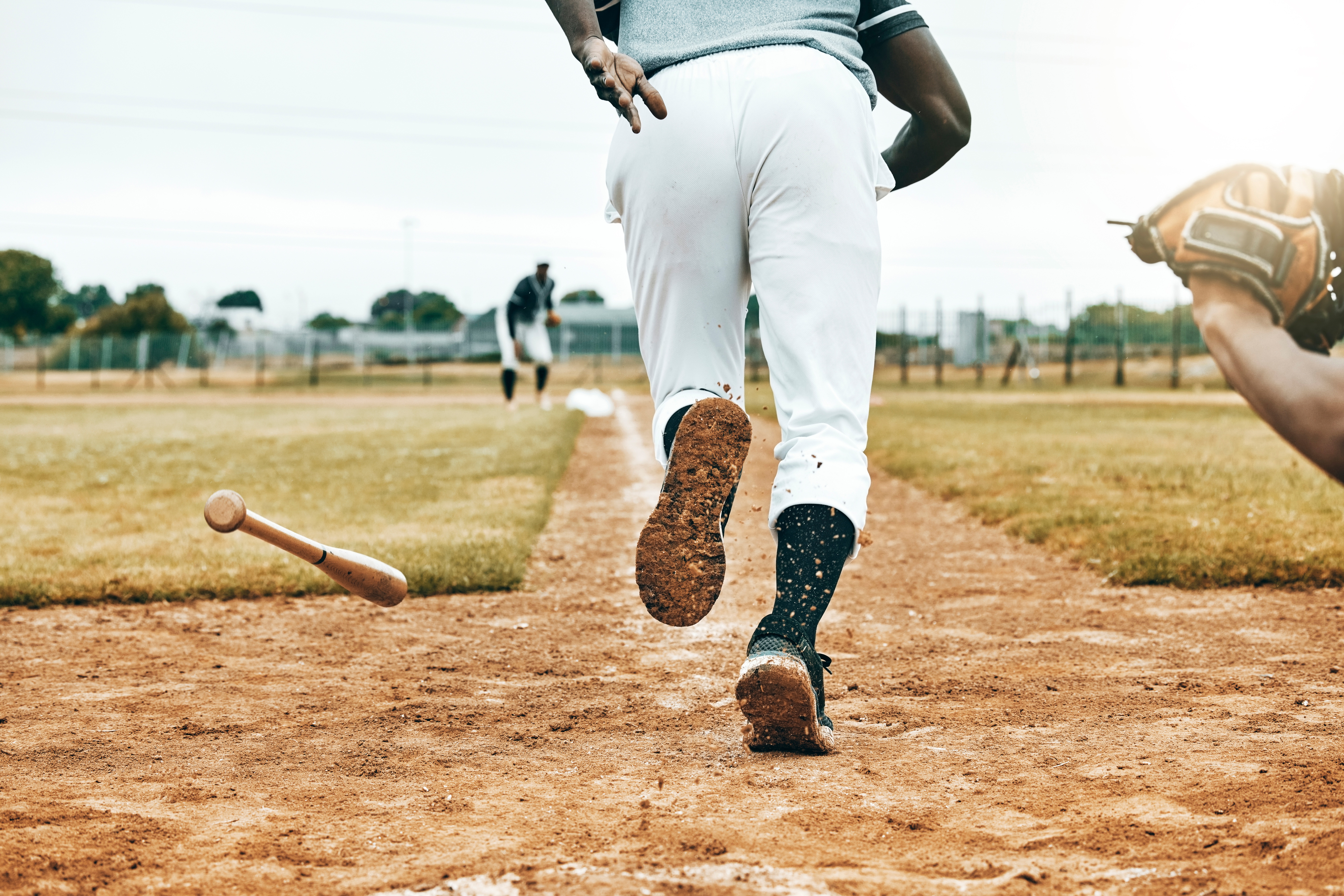 Baseball, sports game and man running in match competition for victory win, exercise or fitness tra.