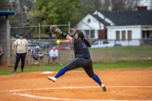 softball pitcher throwing pitch in game