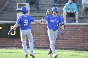 st louis baseball teammates high five