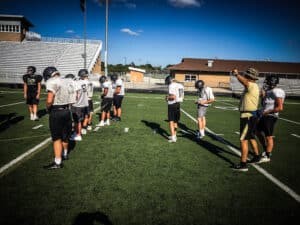 coach walking team through practice with gorout devices