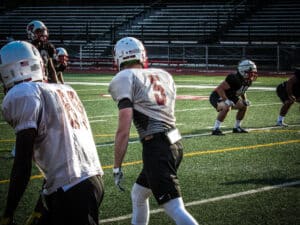 football receivers lining up at practice