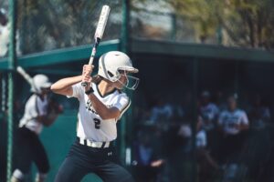 softball player batting in game
