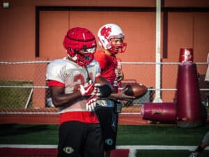 football players using gorout device at practice