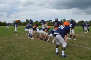 football offense and defense practice against each other
