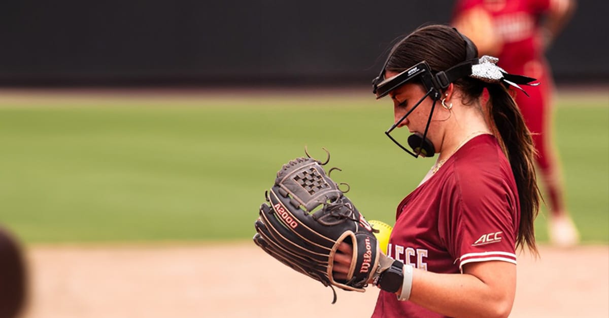 Division I college softball pitcher getting ready to pitch