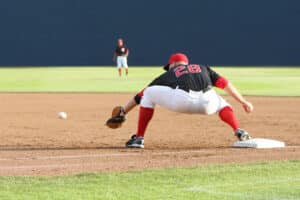 first baseman stretching for ball