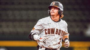 College baseball player trotting around the bases after a homerun