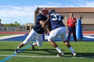 1-on-1 defensive line drills at practice