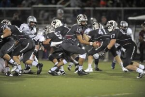 Quarterback giving handoff to the fullback