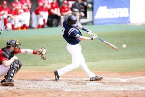 Baseball player making contact at full extension