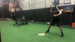 Front toss drills at indoor baseball complex