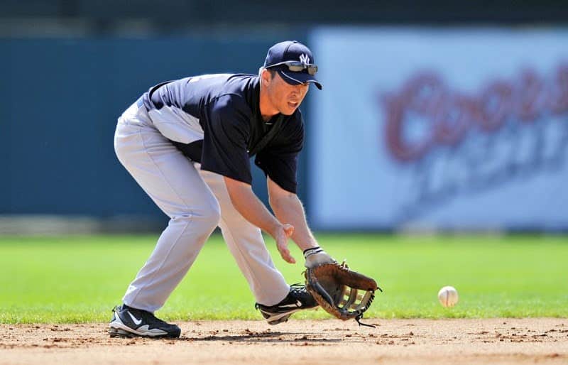 infielder fielding a short hop in spring training practice