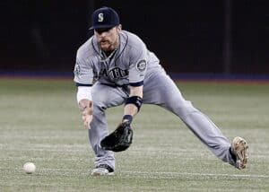 Infielder working around a ground ball to field and throw out a runner