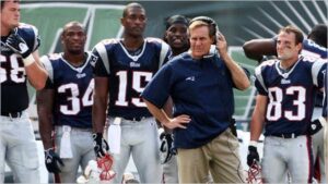 Coach Bill Belichick and his players on the sideline in the year of their sign stealing scandal, spy gate