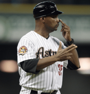 houston astros third base coach touches nose to give sign