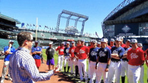 coach addressing players at safeco field for prospect development pipeline event