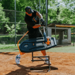 baseball player hitting off training device