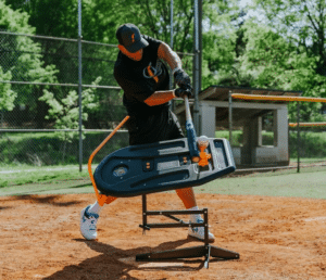 baseball player hitting off training device