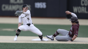 runner sliding into second base while infielder covers