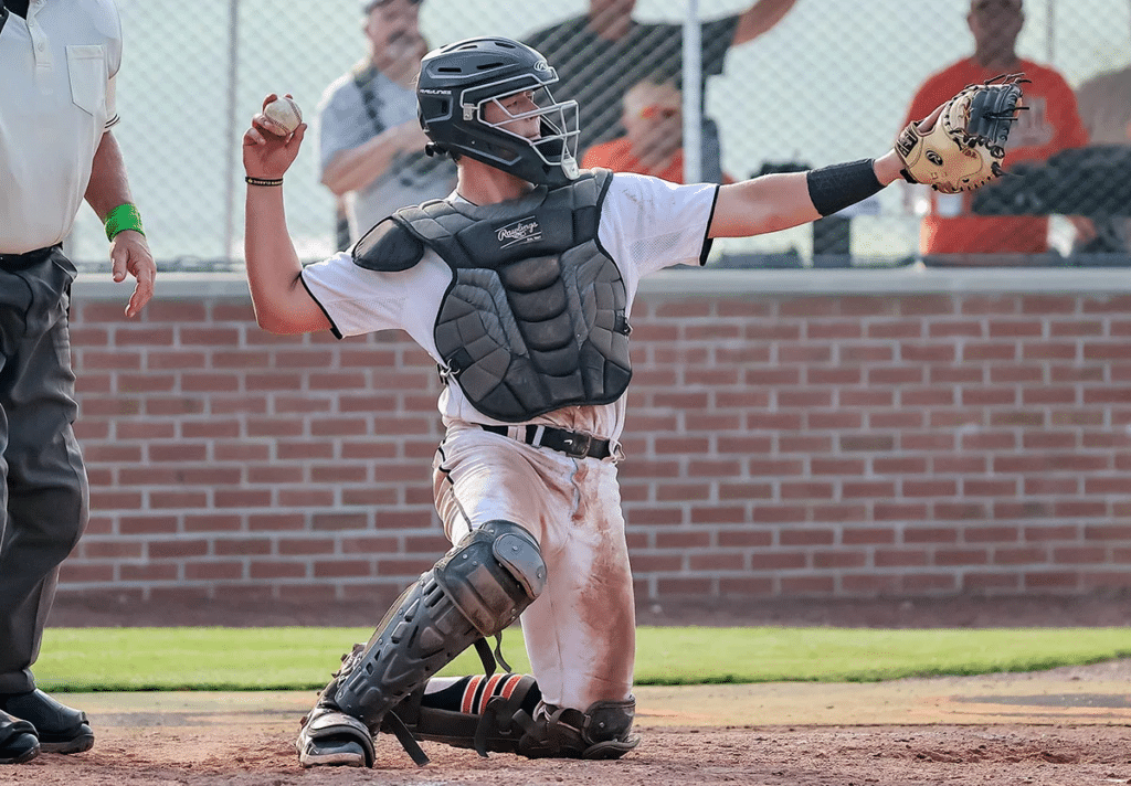 catcher throwing back to pitcher