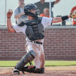 catcher throwing back to pitcher