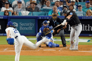 miami marlins batter making contact with pitch from los angeles dodgers pitcher