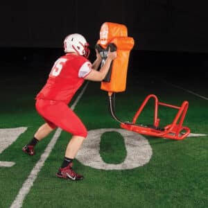 offensive lineman blocking on single-man sled