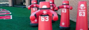 group of five football tackling dummies