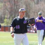 baseball pitcher fist bumping catcher