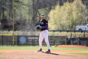 college pitcher stand on pitching rubber in stretch