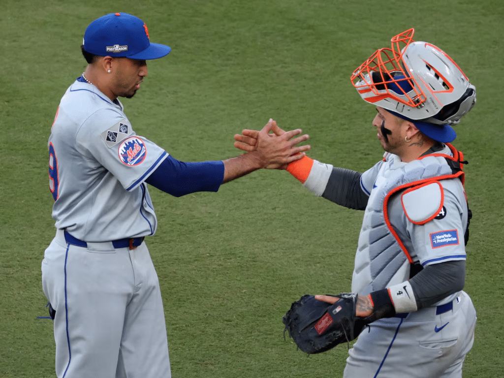 new york mets pitcher and catcher shaking hands